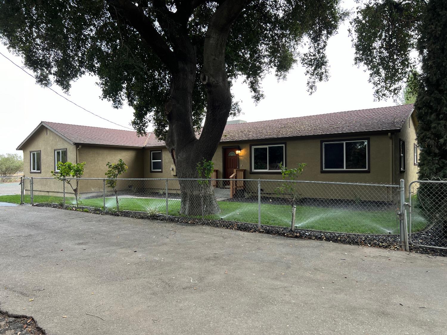 10016 South Priest Road French Camp, CA 95231 - Photo 26 of 63 a view of house in front of a house with large tree