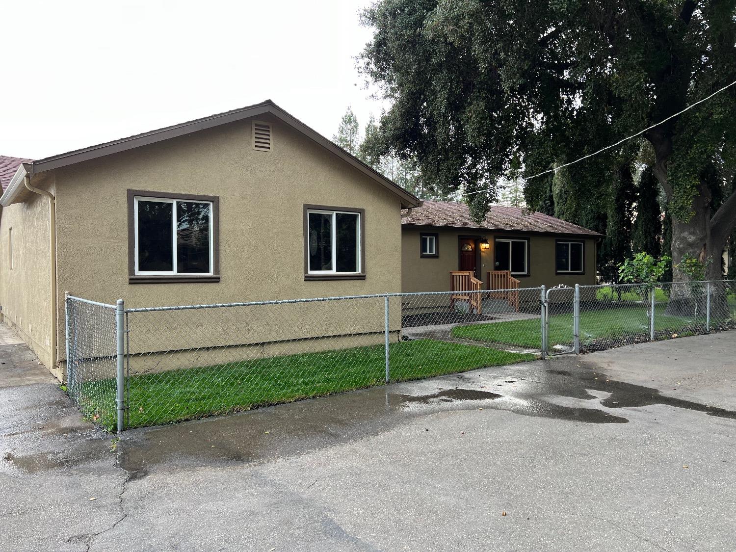 10016 South Priest Road French Camp, CA 95231 - Photo 27 of 63 a front view of a house with a yard and garage