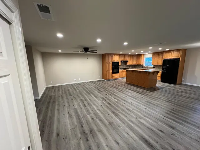 a view of kitchen with wooden floor