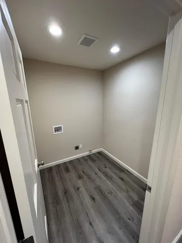 a toilet sitting in a bathroom next to a sink