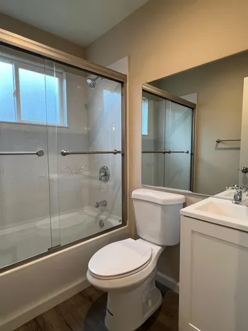 a spacious bathroom with a sink and a mirror