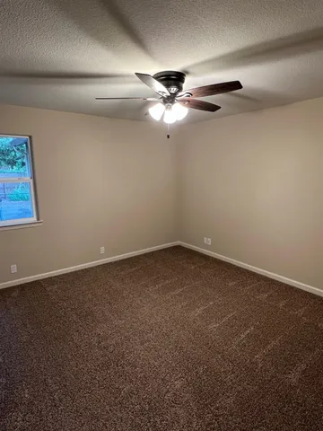 a view of room with furniture and wooden floor