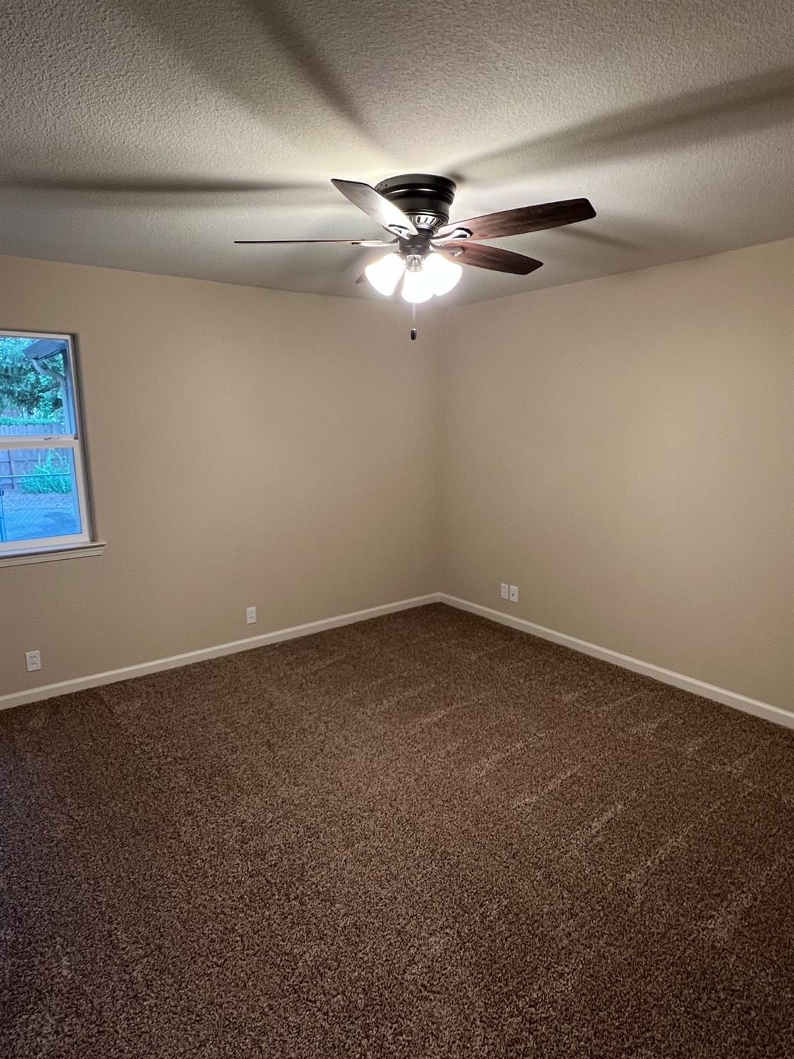 10016 South Priest Road French Camp, CA 95231 - Photo 36 of 63 en empty room with windows and fan