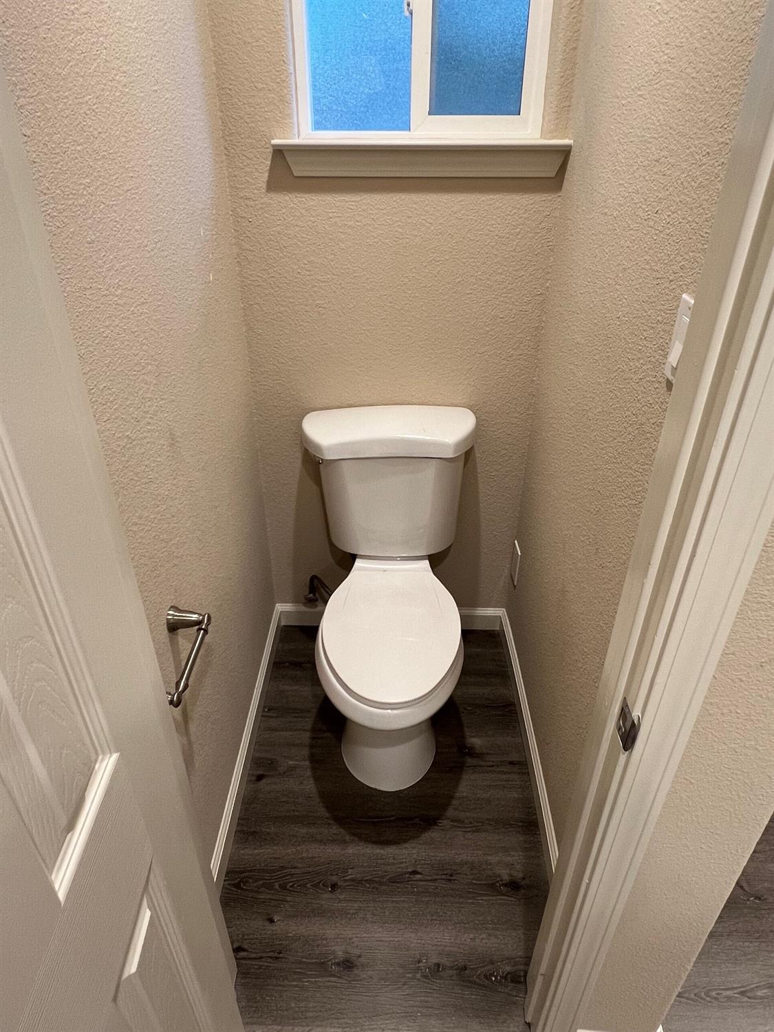 10016 South Priest Road French Camp, CA 95231 - Photo 40 of 63 a toilet sitting in a bathroom next to a sink