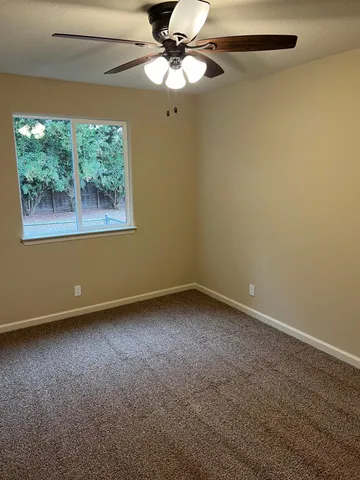 a view of an empty room with stairs