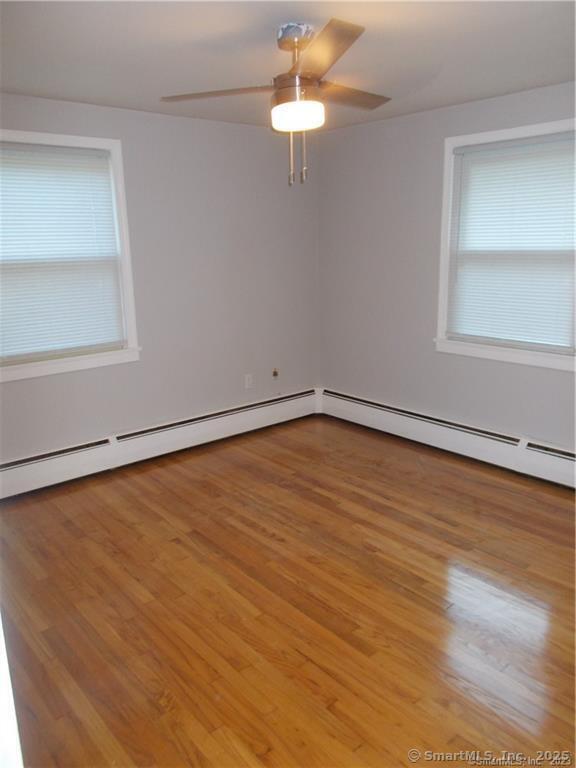 31 Benton Street Winchester, CT 06098 - Photo 14 of 18 wooden floor in an empty room with a window