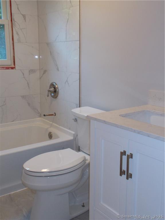 31 Benton Street Winchester, CT 06098 - Photo 5 of 18 a white toilet sitting next to a bath tub