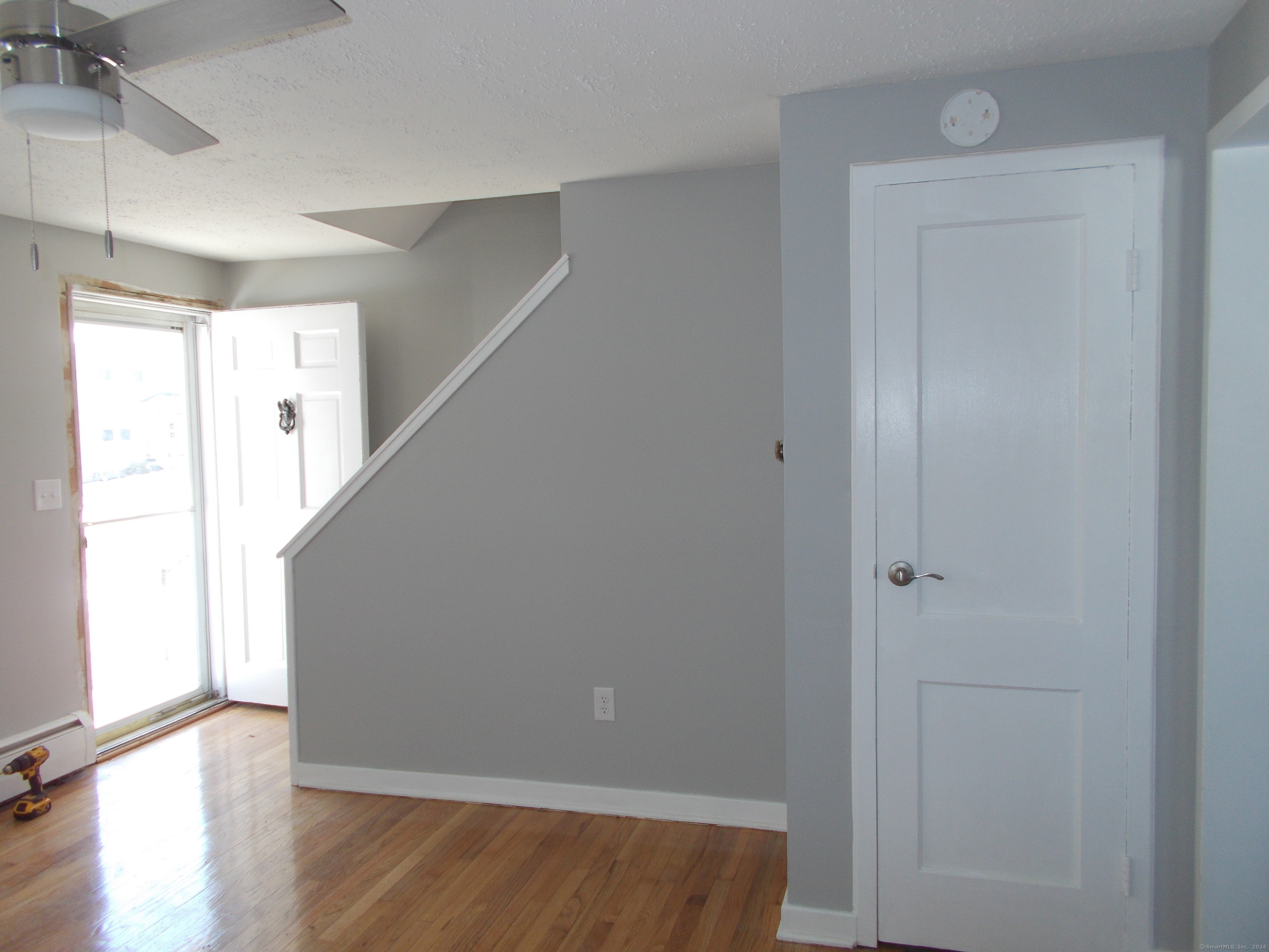 31 Benton Street Winchester, CT 06098 - Photo 7 of 18 a view of hallway with window and wooden floor