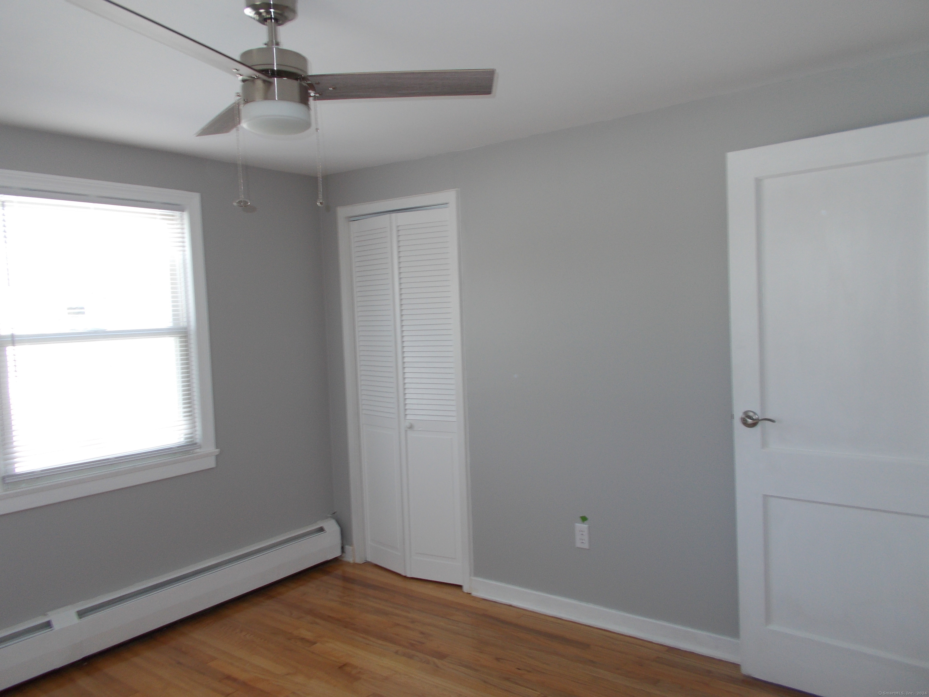 31 Benton Street Winchester, CT 06098 - Photo 9 of 18 a view of an empty room with wooden floor and a window