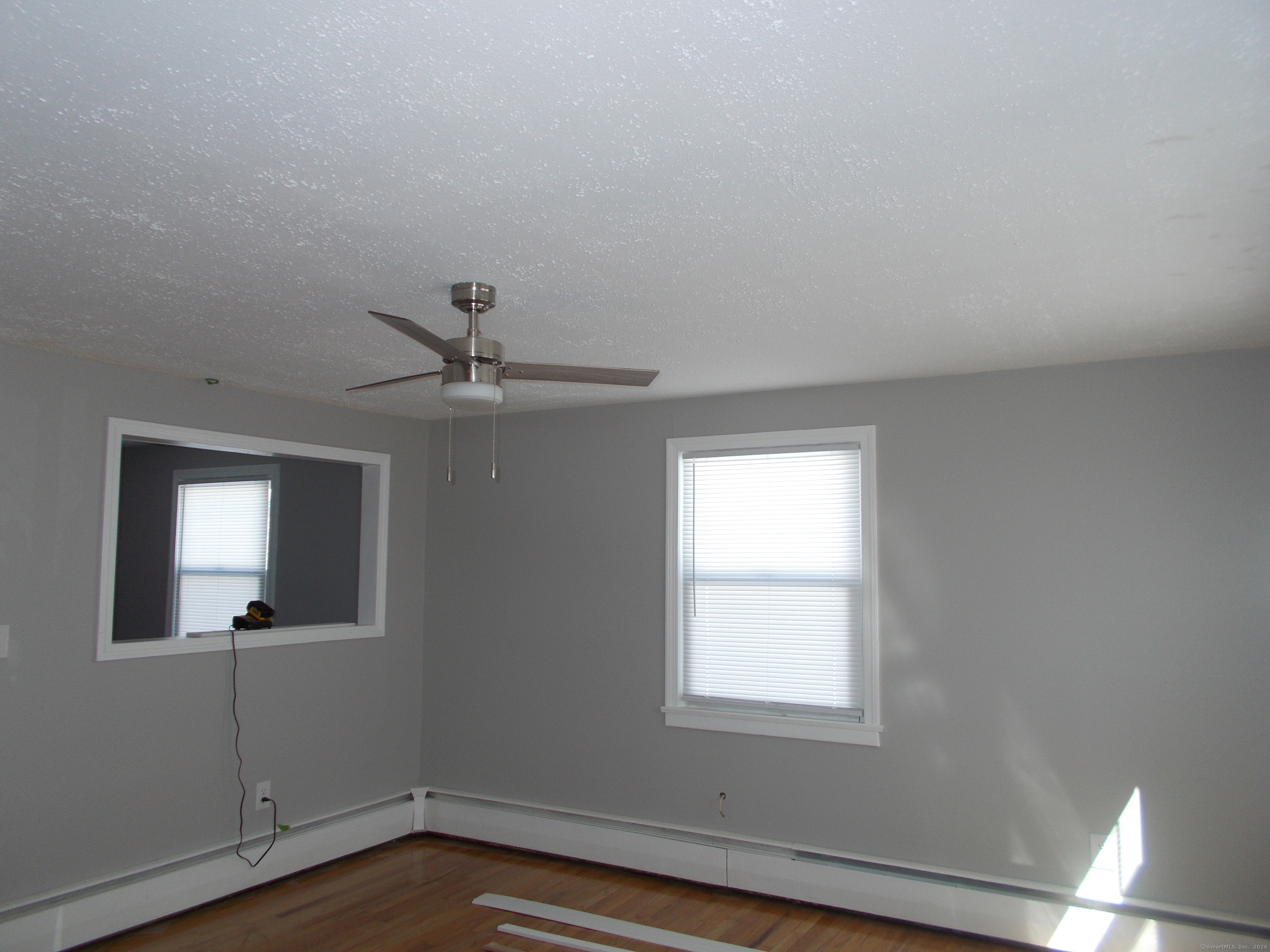 31 Benton Street Winchester, CT 06098 - Photo 10 of 18 an empty room with a window and a ceiling fan