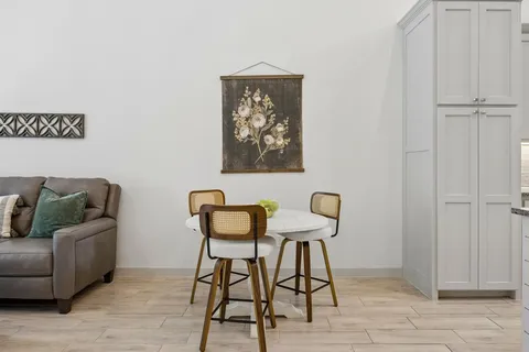 a view of a livingroom with furniture and a window