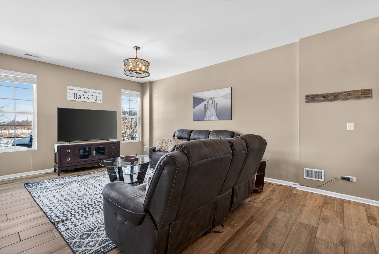 15238 Kenmare Circle Manhattan, IL 60442 - Photo 11 of 29 a living room with furniture and a flat screen tv