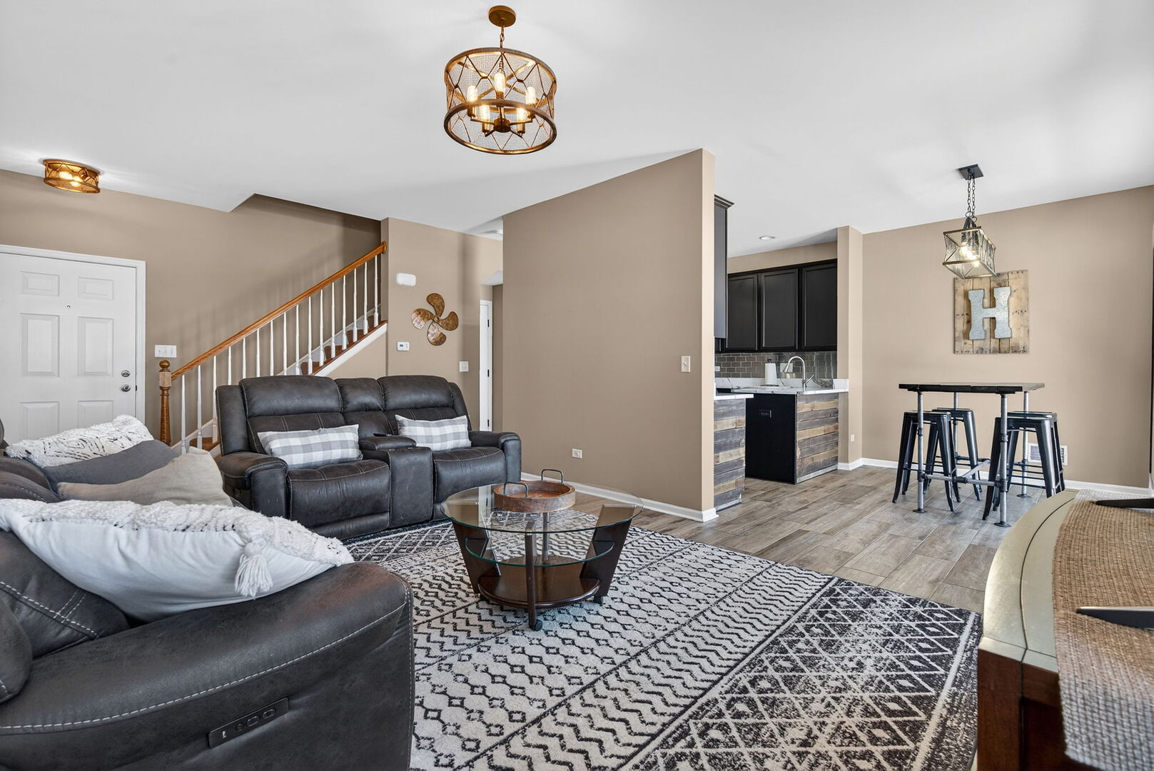 15238 Kenmare Circle Manhattan, IL 60442 - Photo 12 of 29 a living room with furniture a couch and a table