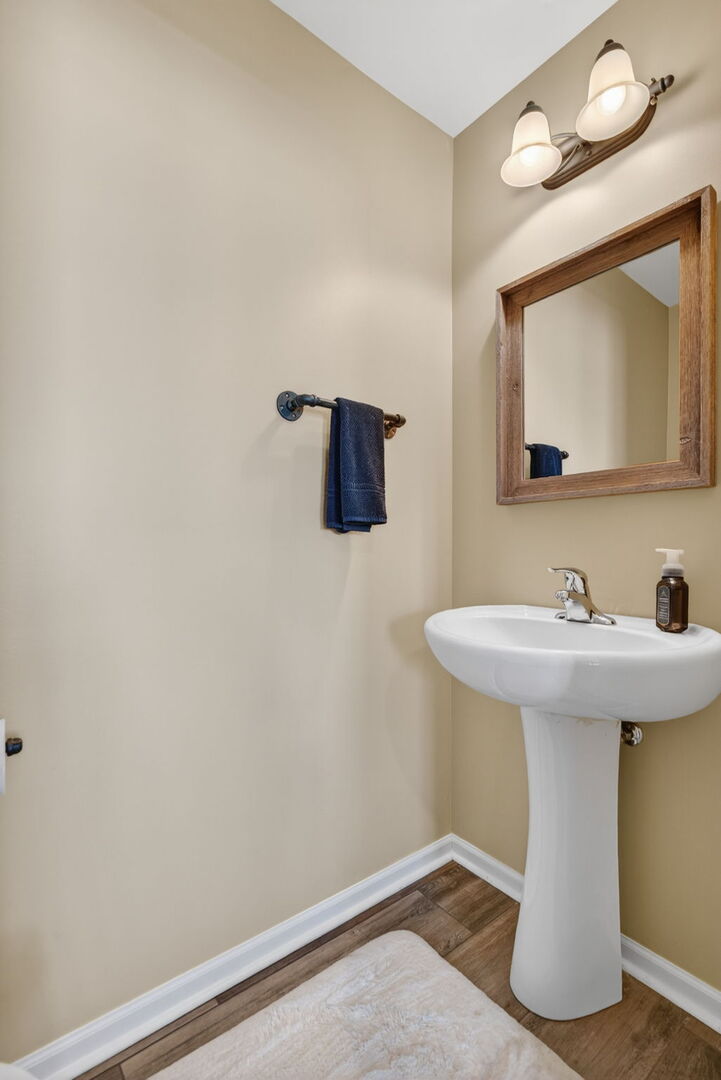 15238 Kenmare Circle Manhattan, IL 60442 - Photo 14 of 29 a bathroom with a sink and a mirror