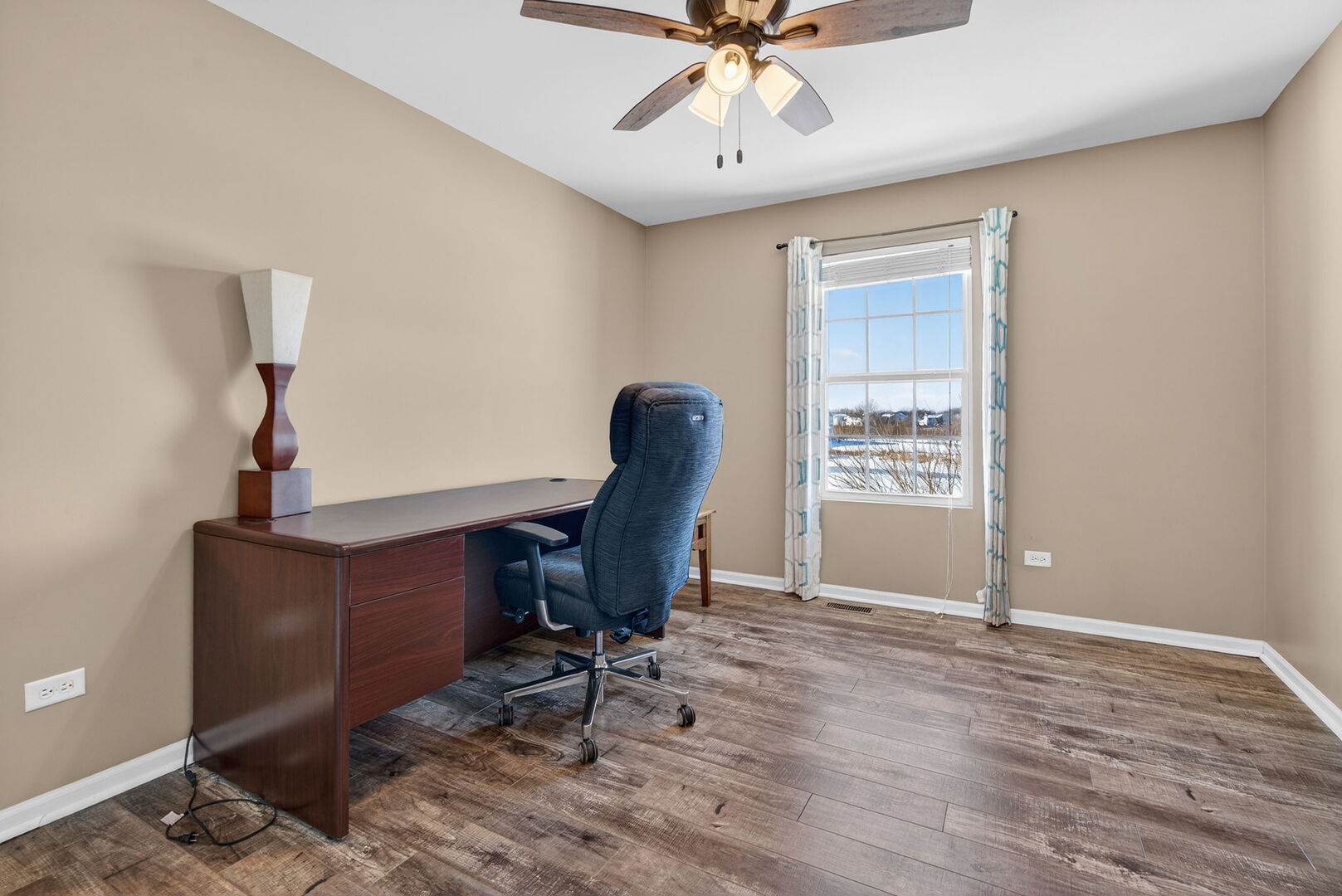 15238 Kenmare Circle Manhattan, IL 60442 - Photo 18 of 29 a view of workspace with wooden floor windows