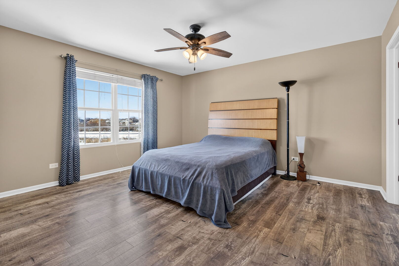 15238 Kenmare Circle Manhattan, IL 60442 - Photo 19 of 29 a bedroom with a bed and window