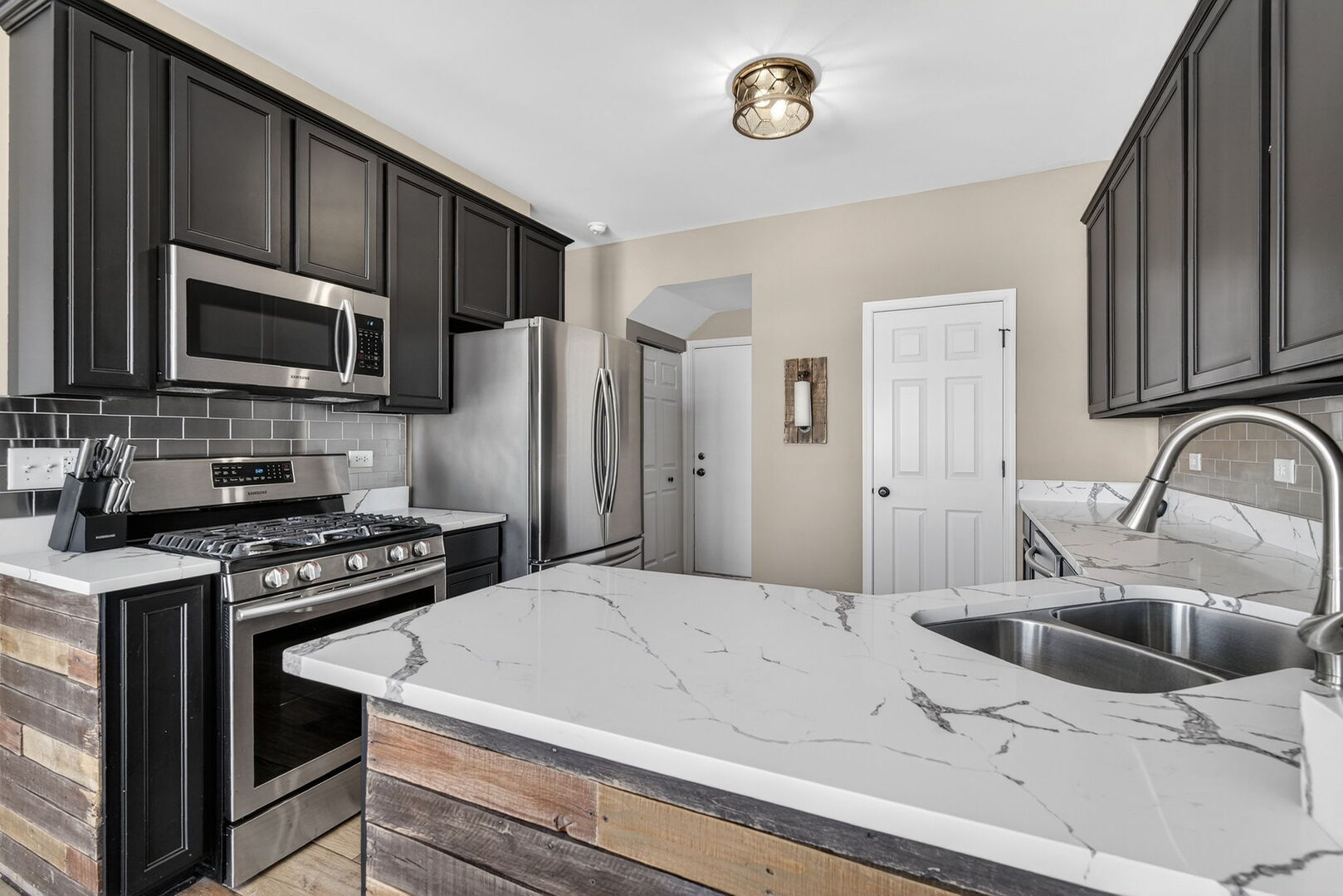 15238 Kenmare Circle Manhattan, IL 60442 - Photo 2 of 29 a kitchen with a sink a stove and refrigerator