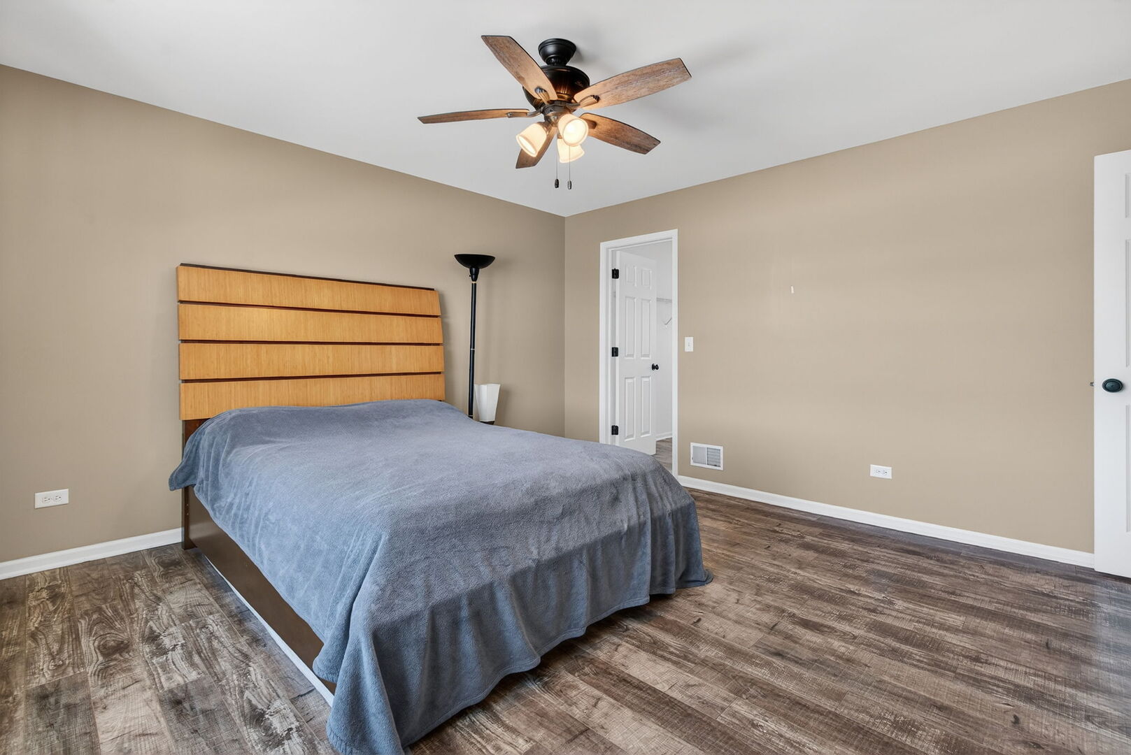 15238 Kenmare Circle Manhattan, IL 60442 - Photo 21 of 29 a bedroom with a bed and a ceiling fan