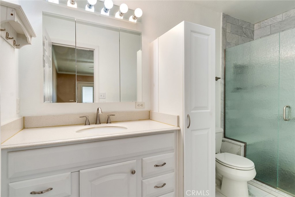 9130 Duncan Avenue Riverside, CA 92503 - Photo 22 of 34 a bathroom with a sink and a mirror