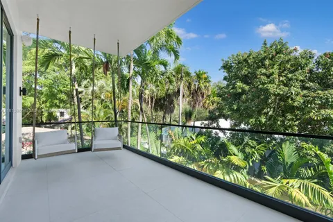 a bedroom with a bed and wall painting