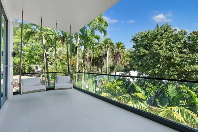 a bedroom with a bed and wall painting