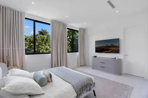a bathroom with a sink vanity and toilet