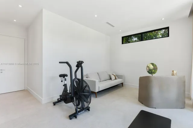 a view of a balcony with flower plants