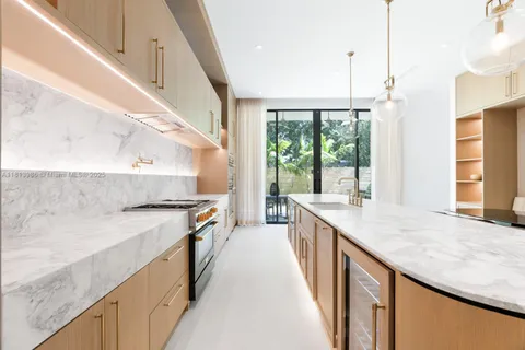 a kitchen with a stove and a sink