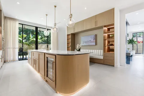 a view of living room with furniture and large windows