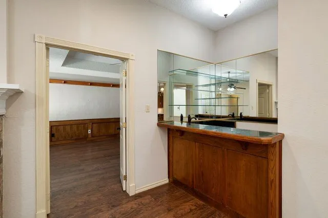 a kitchen with kitchen island a counter top space and a sink