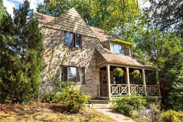 front view of a house with a garden