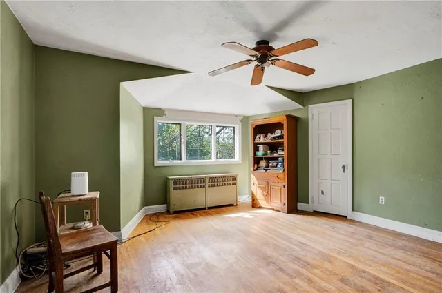 a room with a bed and a desk