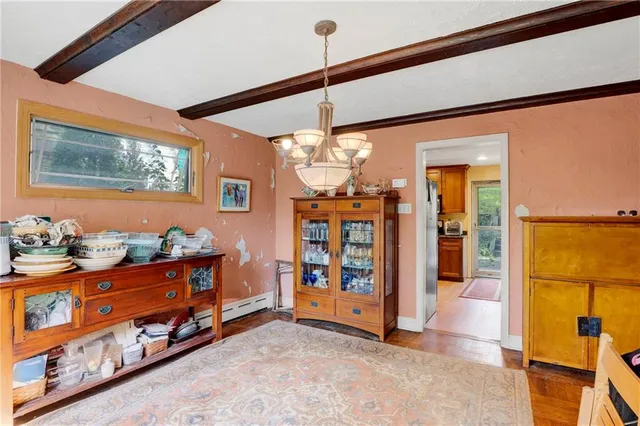 a view of a room with window and furniture