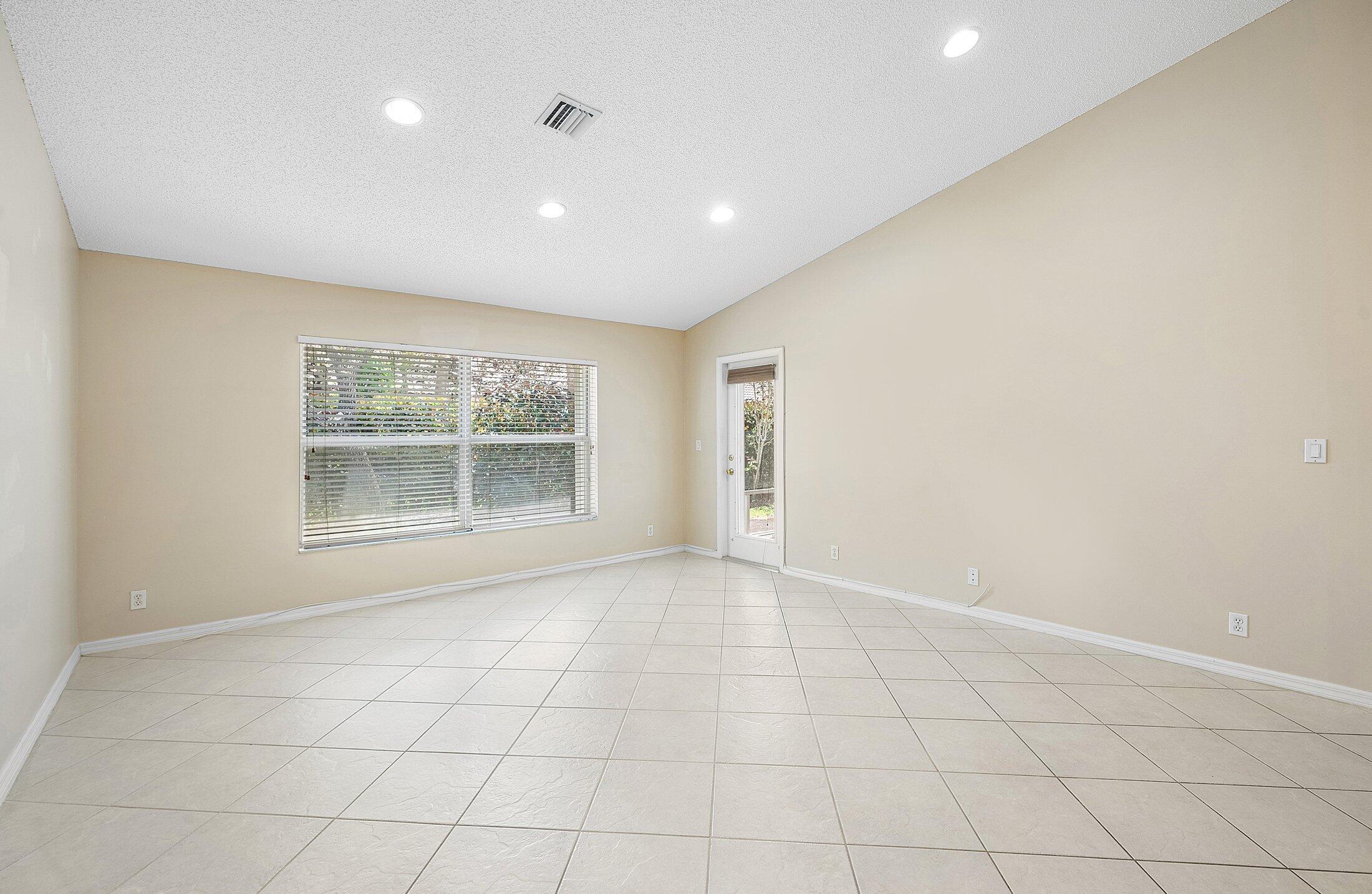 6060 Petunia Road Delray Beach, FL 33484 - Photo 12 of 59 a view of an empty room with a window