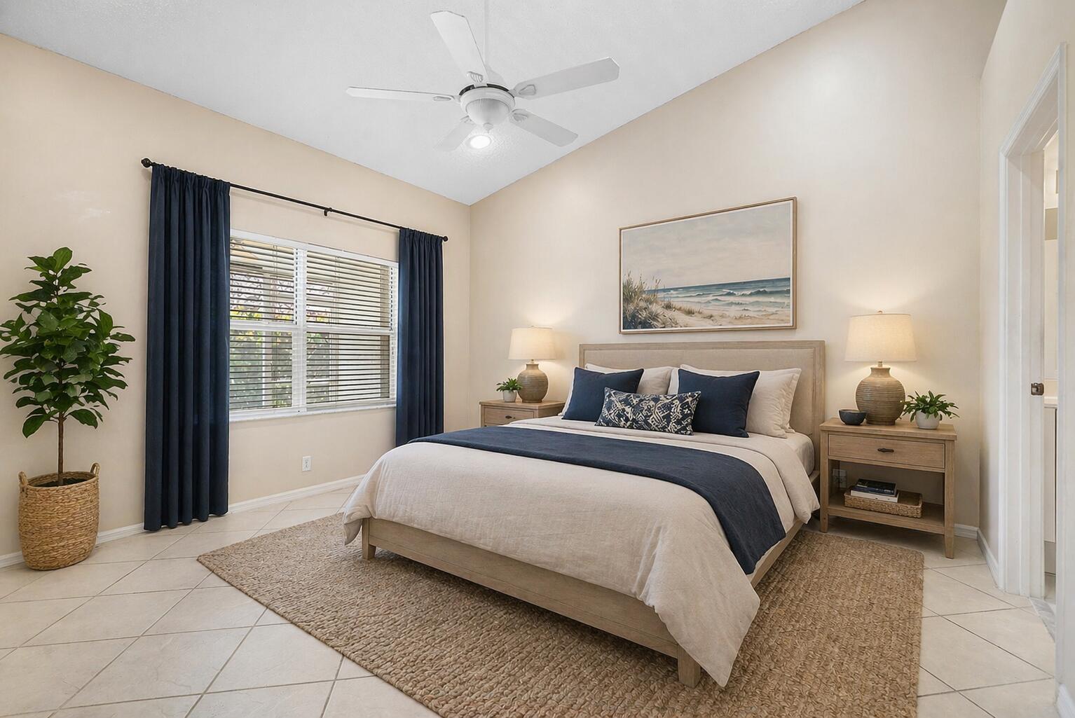 6060 Petunia Road Delray Beach, FL 33484 - Photo 16 of 59 a bedroom with a large bed and potted plant with window
