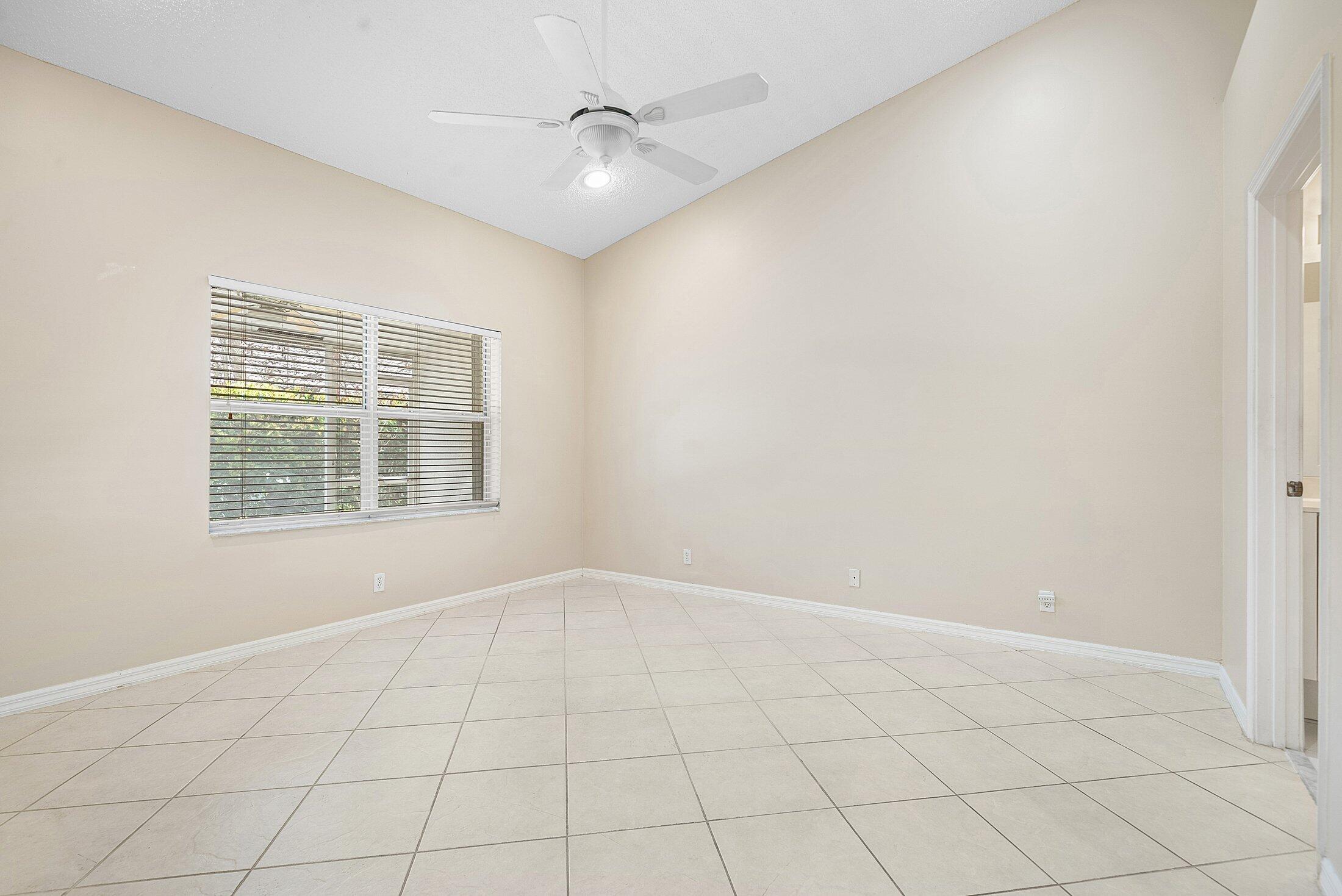6060 Petunia Road Delray Beach, FL 33484 - Photo 17 of 59 a view of an empty room with a window