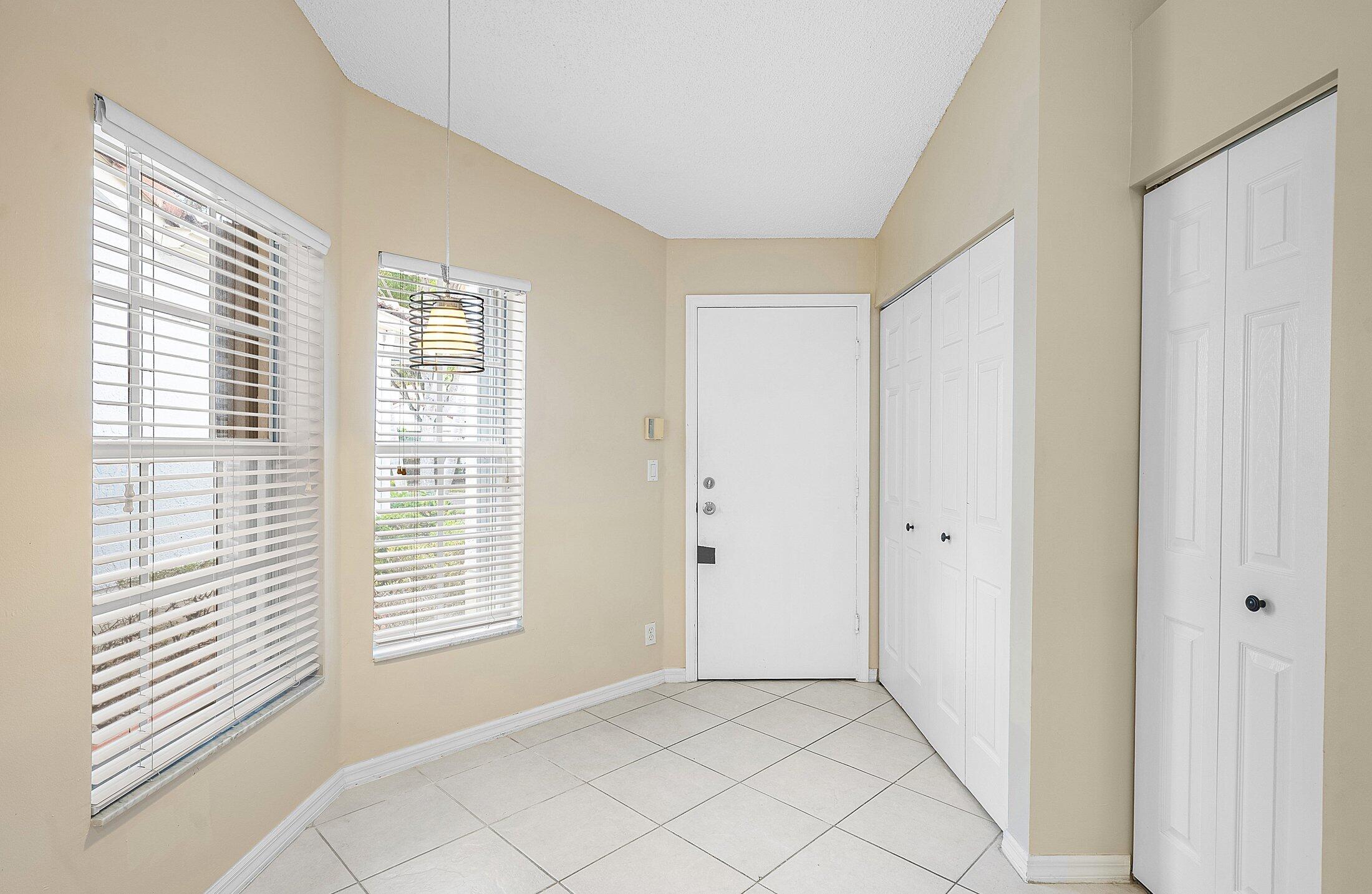 6060 Petunia Road Delray Beach, FL 33484 - Photo 8 of 59 a view of an empty room with a window
