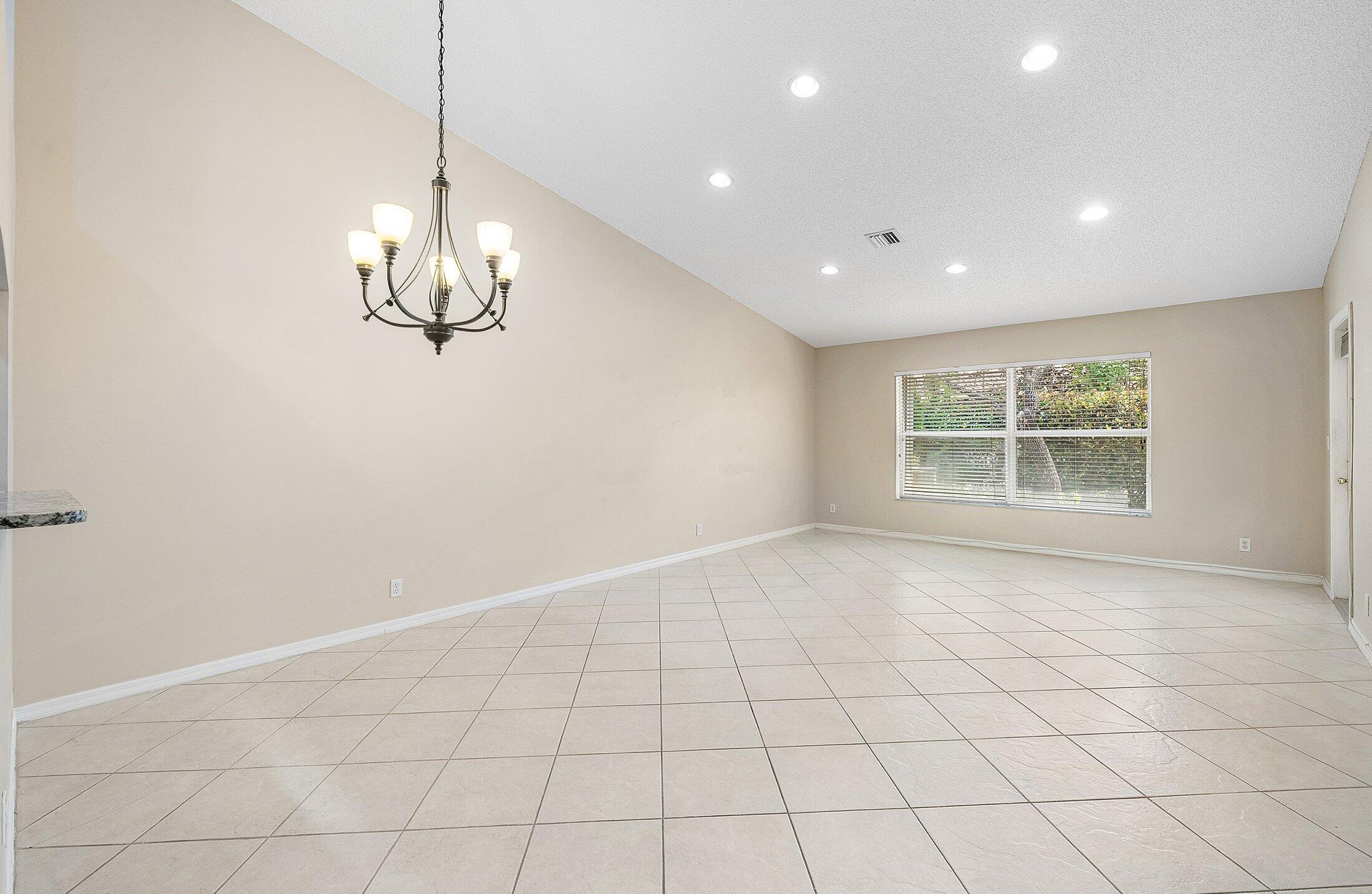 6060 Petunia Road Delray Beach, FL 33484 - Photo 10 of 59 a view of an empty room with a window