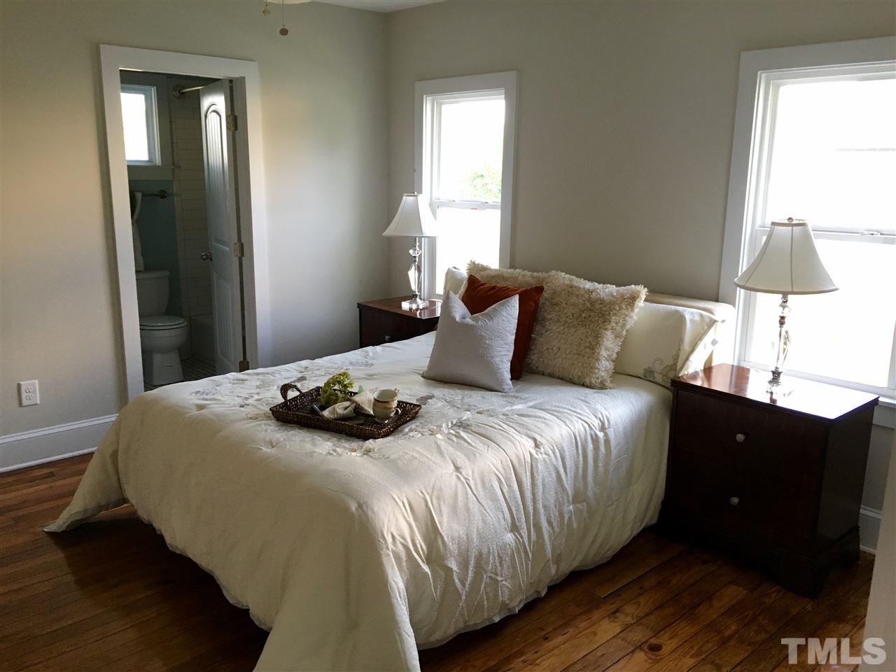 321 Bledsoe Avenue Raleigh, NC 27601 - Photo 11 of 18 a bedroom with a bed and a window