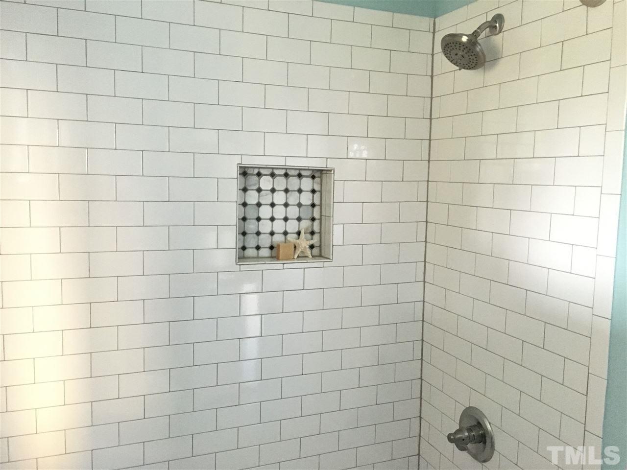 321 Bledsoe Avenue Raleigh, NC 27601 - Photo 13 of 18 a bathroom with a shower