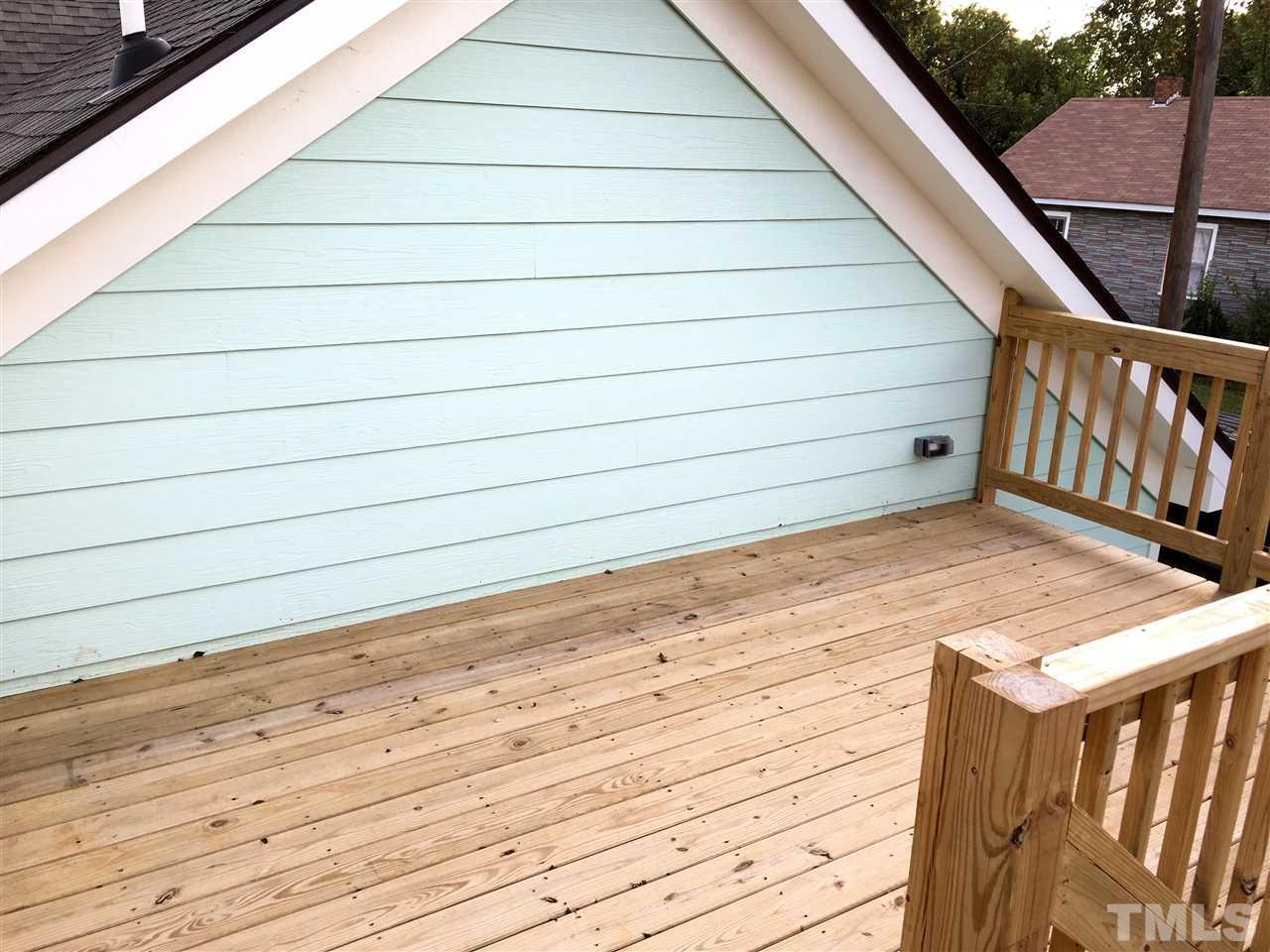 321 Bledsoe Avenue Raleigh, NC 27601 - Photo 14 of 18 a view of a balcony with wooden floor