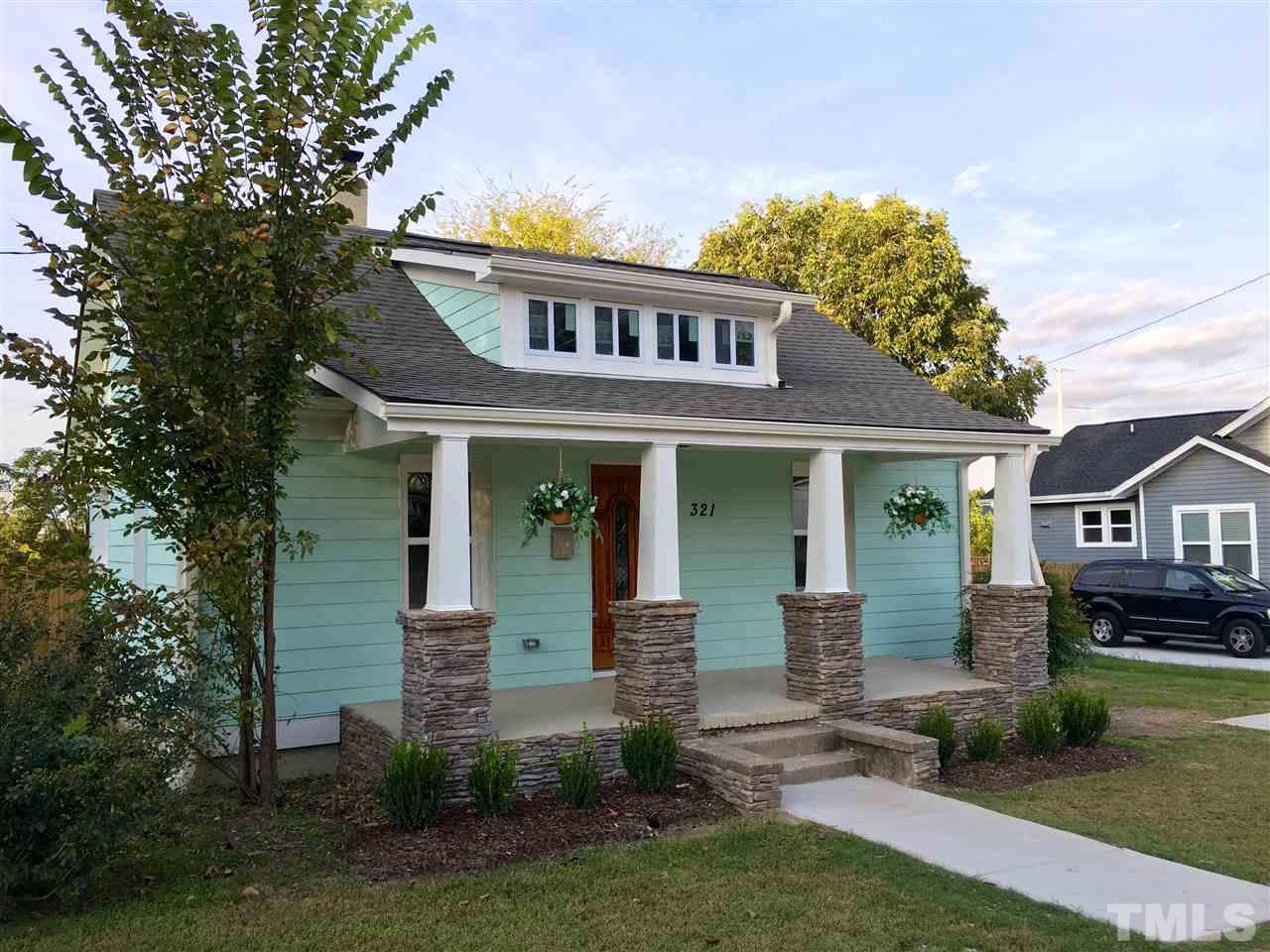 321 Bledsoe Avenue Raleigh, NC 27601 - Photo 16 of 18 a front view of a house with garden