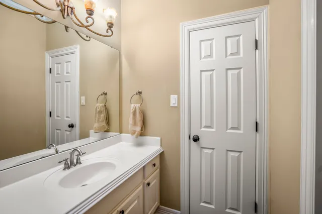 a bathroom with a sink a mirror and a shower
