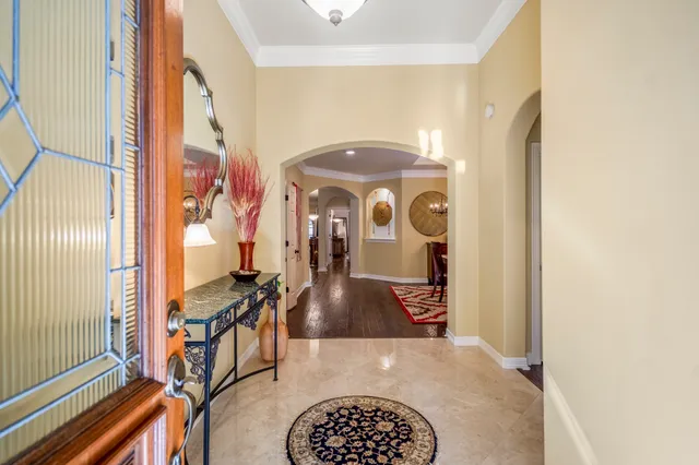 a view of a livingroom with furniture and a chandelier