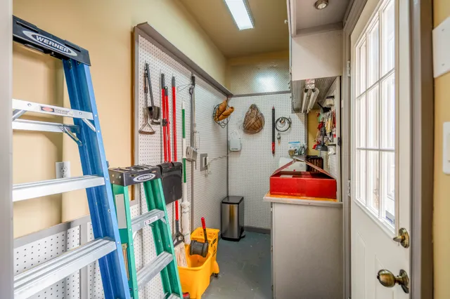 a view of patio with table and chairs and potted plants