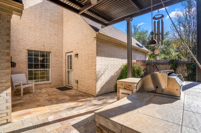 a view of a chairs and table in the balcony