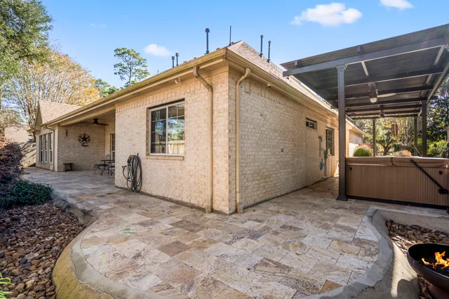 a view of a backyard with sitting area