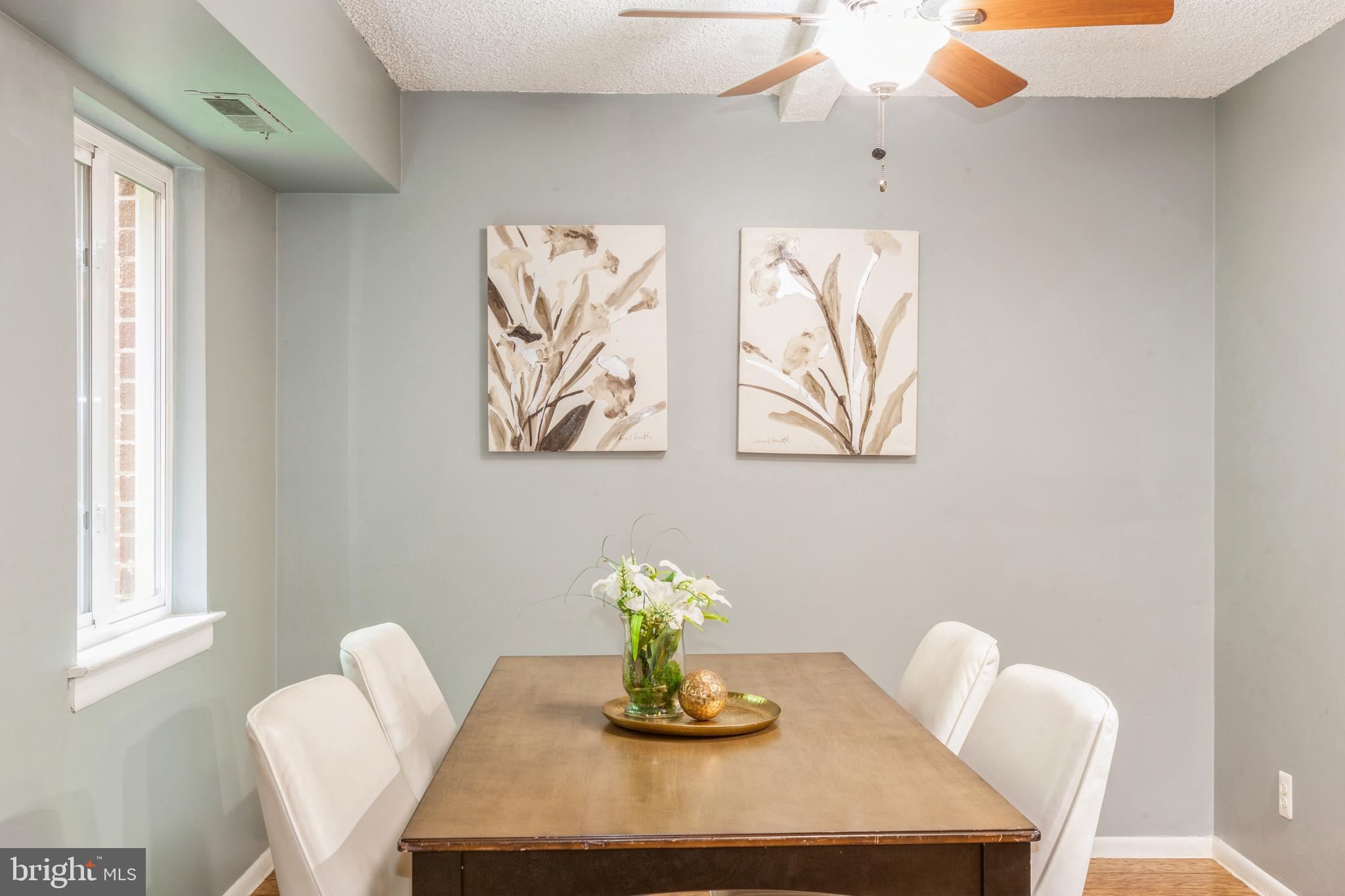 11833 Shire Court, Unit 12C Reston, VA 20191 - Photo 11 of 28 a view of a dining room with furniture and wooden floor