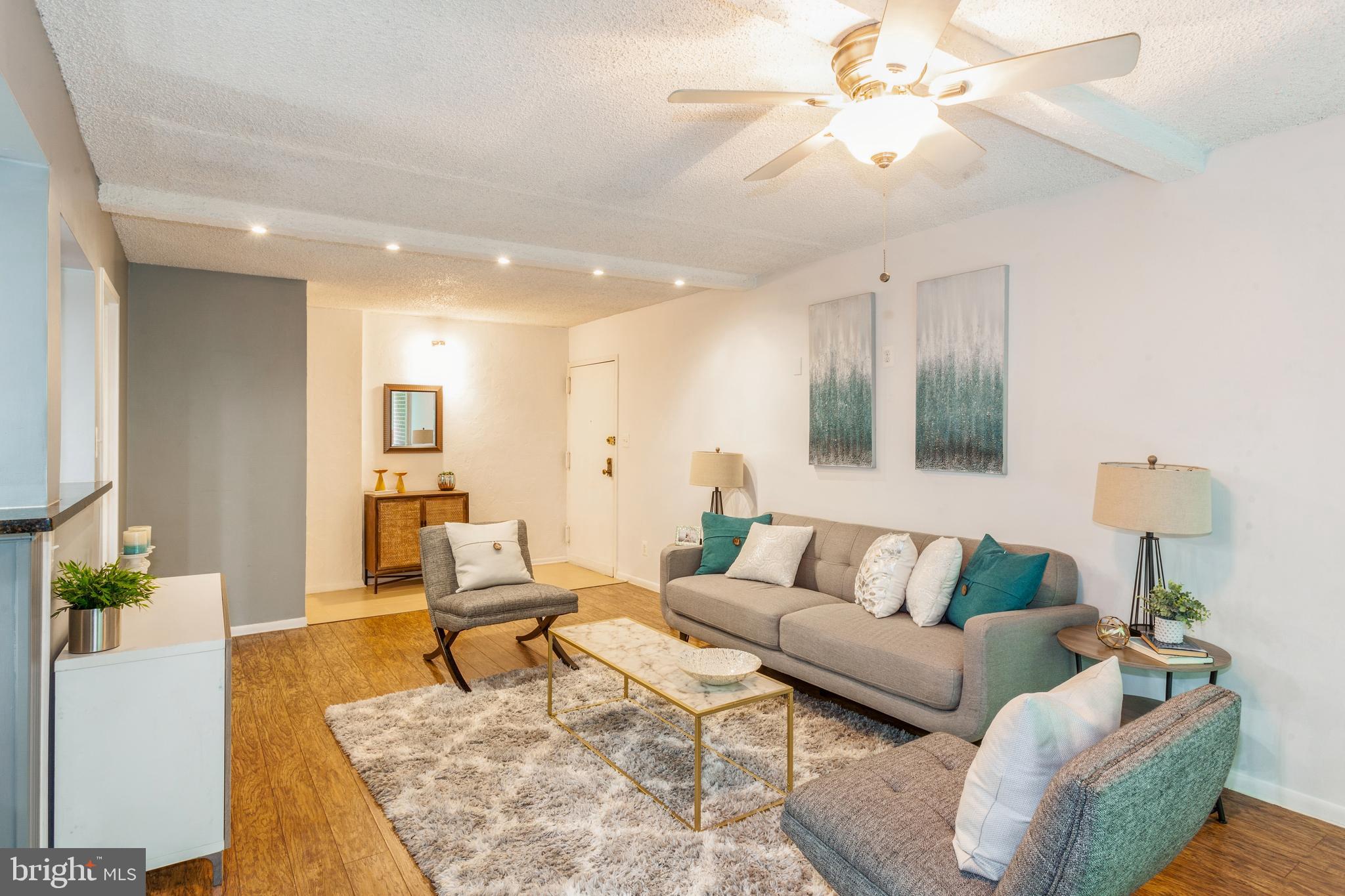 11833 Shire Court, Unit 12C Reston, VA 20191 - Photo 2 of 28 a living room with furniture and a couch