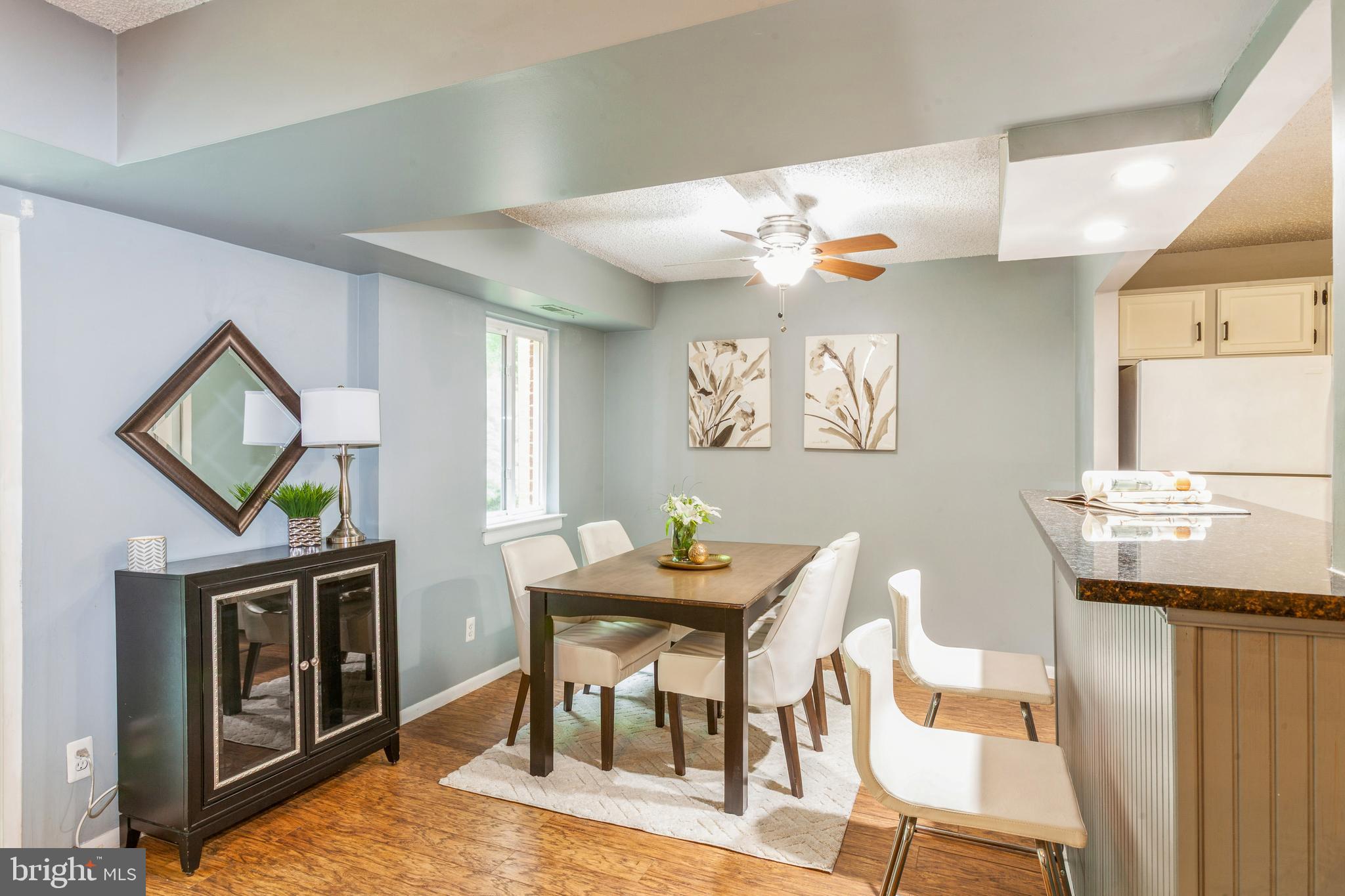 11833 Shire Court, Unit 12C Reston, VA 20191 - Photo 7 of 28 a view of a dining room with furniture and wooden floor